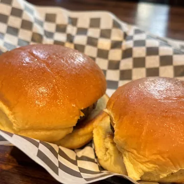 Two hamburger sliders on brioche buns