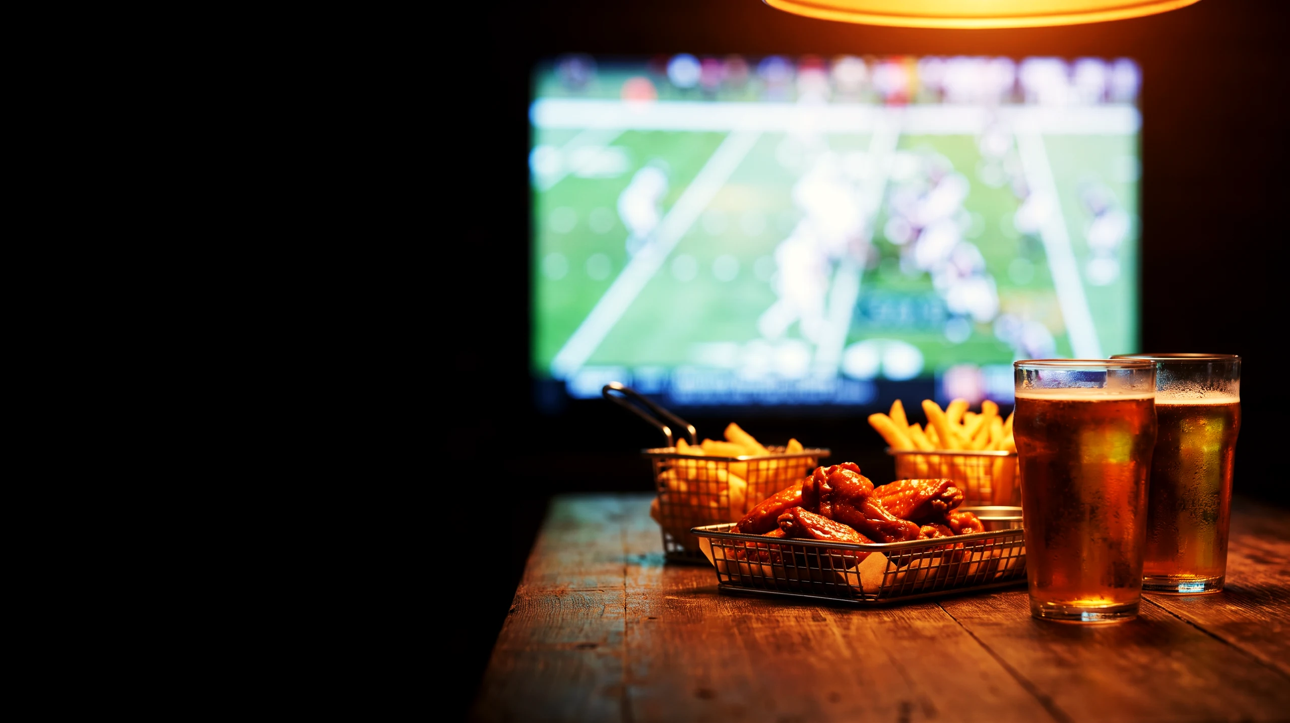 A wall of screens showing live football